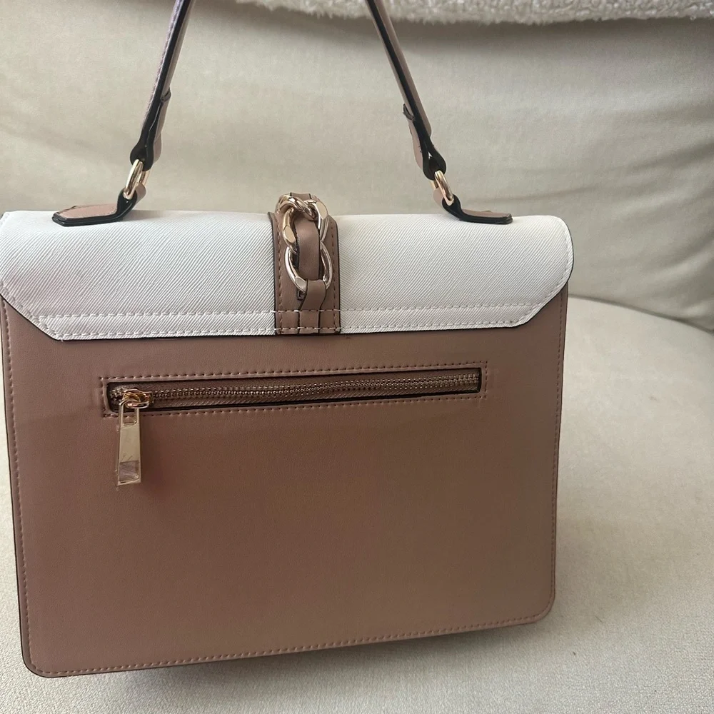 ALDO women's handbag with a top handle and chain detail.